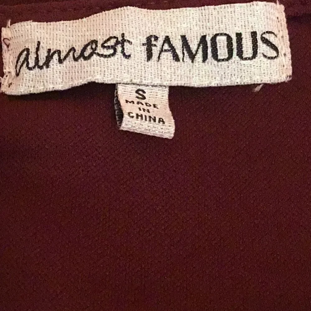 Short sleeved dress in 2 tone burgundy & black in small by ALMOST FAMOUS